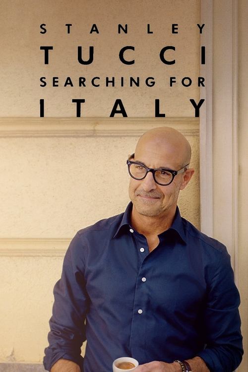 Stanley Tucci stands confidently against a warm, cream-colored backdrop, exuding elegance and charm. His dark blue shirt contrasts beautifully with the soft tones, creating a sophisticated mood. The poster captures the essence of his charismatic presence, inviting viewers to imagine the captivati...