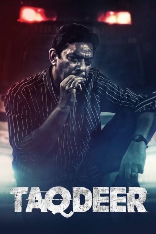The poster features a rugged man in a striped shirt, holding a microphone with a dramatic, intense expression. The background is dark with red emergency lights, suggesting urgency or danger. The title "TAQDEER" is prominently displayed in bold, distressed white letters, conveying a gritty, action...