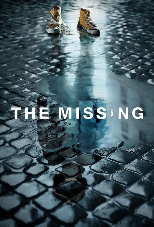The poster features two shoes standing on a wet cobblestone path, reflecting in the puddles below. The muted blue and gray tones create a somber, mysterious atmosphere, hinting at a missing person story.