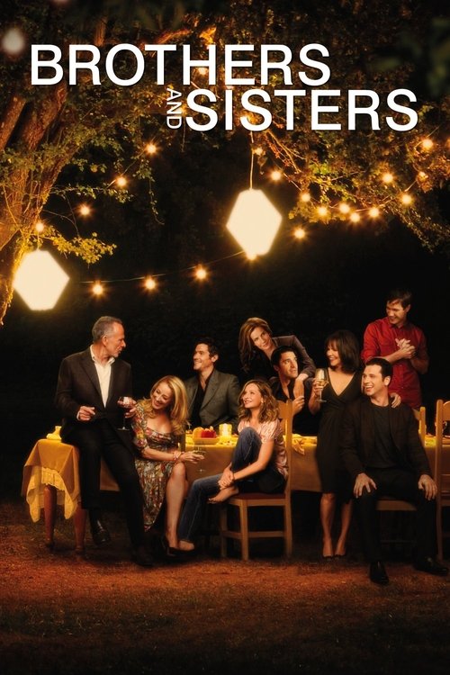 The poster features a group of people gathered around a table under a tree at night, illuminated by warm string lights. The mood is intimate and familial, capturing a moment of connection among the characters.