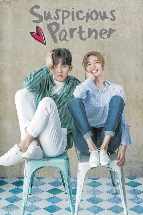 The poster features two young people sitting on a blue stool against a textured beige wall. The man wears a green jacket and white pants, while the woman dons a light blue shirt and jeans. Their expressions range from serious to playful, suggesting an intriguing relationship. The blue and white c...