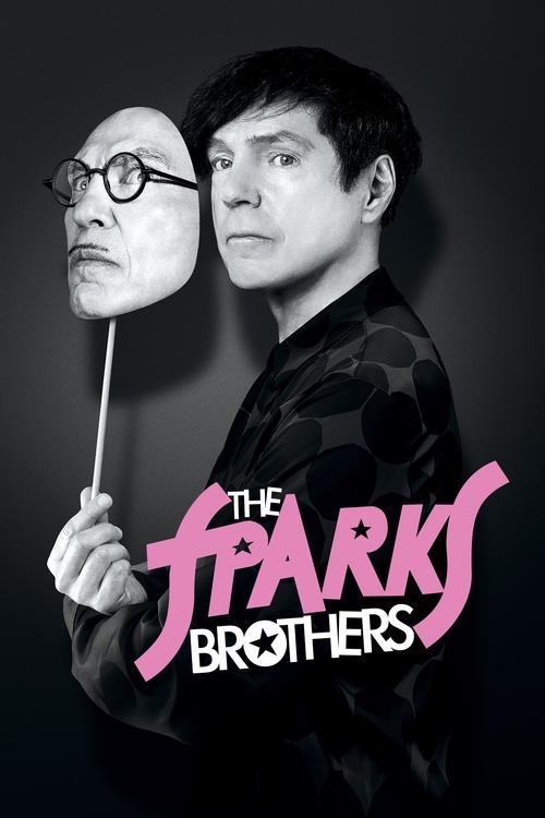 The poster features two men in a dramatic pose against a dark background. One man holds a giant, realistic-looking mask of the other, creating a surreal and intense atmosphere. The title "The Sparks Brothers" is prominently displayed in bold, pink lettering, emphasizing the film's title. The over...
