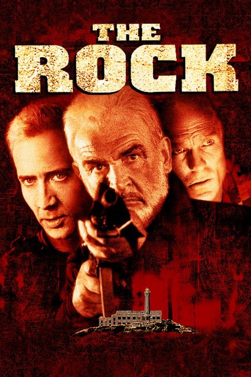 The poster features three men in a gritty, red-toned atmosphere, with one holding a gun and the others looking intense. The title "THE ROCK" is prominently displayed in bold, distressed typography.