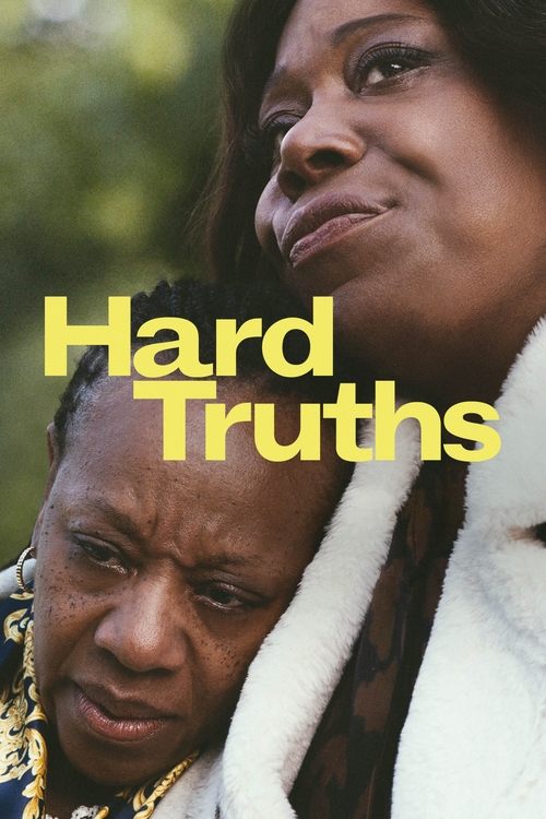 The poster features two women in a close embrace, one with a serious expression and the other with a more contemplative look. The bold yellow text "Hard Truths" stands out against the warm, earthy tones of their skin and the soft white fur around their necks. The mood is somber yet hopeful, sugge...