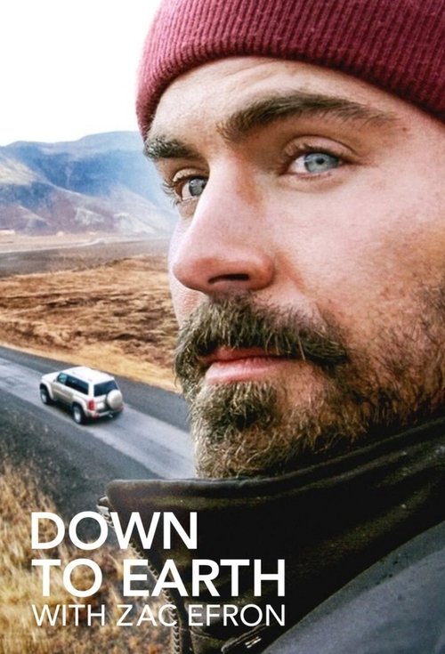 The poster features Zac Efron in a close-up, wearing a maroon beanie against a rugged, arid landscape. The muted earth tones and desolate scenery evoke a sense of isolation and introspection, while the bold white text "Down to Earth" and "With Zac Efron" anchors the image with a clear message.