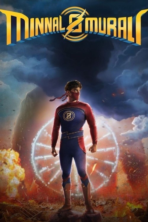 The poster features a muscular superhero in a red and blue suit, standing confidently against a dramatic sky. A glowing, circular emblem behind him suggests power or magic. The fiery background hints at action and adventure. The title "Minnal Murali" is prominently displayed at the top in bold, s...