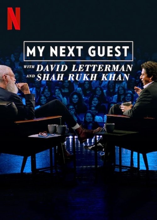 The poster features two men in dimly lit chairs, one with a white beard and the other with dark hair, seated across from each other on a stage with blue lighting. The title "My Next Guest" is prominently displayed in bold white text, with the Netflix logo in the top left corner. The overall mood ...