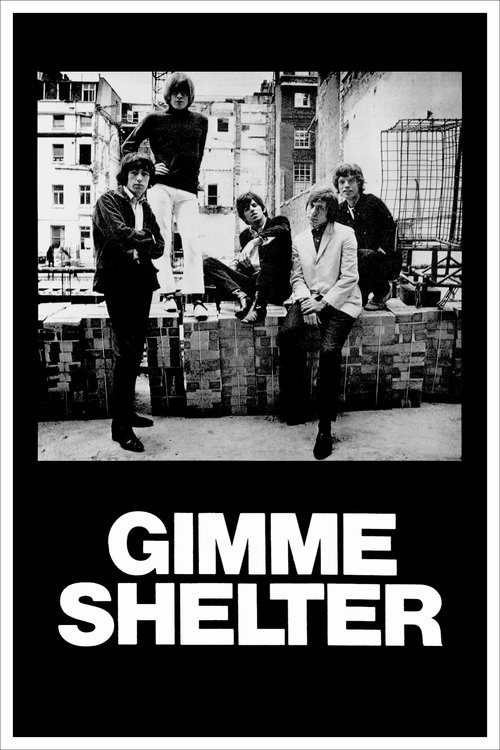 The poster features a gritty urban scene with five people standing on a brick wall, exuding a rebellious and defiant mood. The monochrome palette emphasizes the raw, unfiltered nature of the film's themes. The bold, white text "GIMME SHELTER" anchors the image, suggesting a bold, unconventional a...
