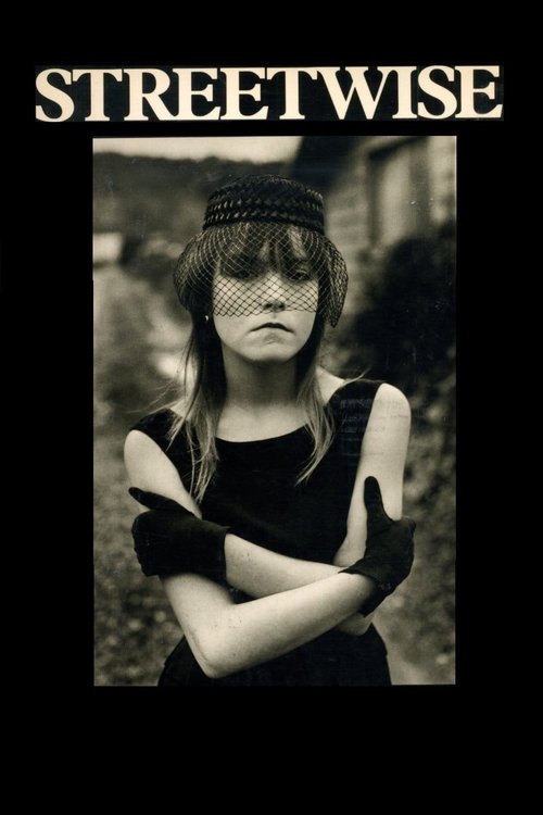 The poster features a striking black-and-white portrait of a woman with her arms crossed, exuding a rebellious and edgy vibe. The bold, capitalized "STREETWISE" text at the top reinforces the film's gritty and urban theme.