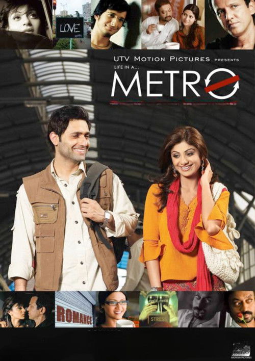 The poster features a vibrant scene with a man in a brown vest and woman in yellow, standing in a bustling train station. The title "Metro" is prominently displayed in bold red letters, with the tagline "Life in a Metro" above it. The overall mood is lively and energetic, capturing the essence of...