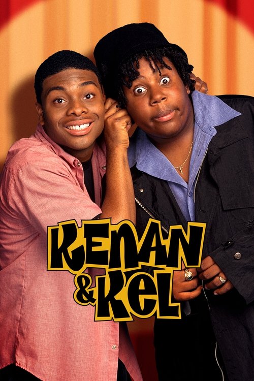 The poster features two young men with expressive faces, one in a pink shirt and the other in a dark jacket, both smiling warmly. The title "KENAN & KEL" is prominently displayed in bold, yellow letters with a black outline. The warm orange background adds a cozy, inviting atmosphere to the image.