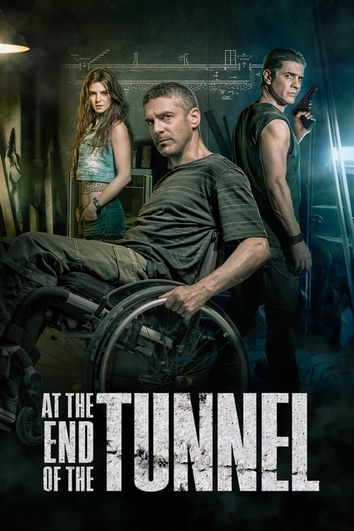 The poster features a gritty, dark scene with three characters in a dimly lit environment. A man in a wheelchair dominates the foreground, while two others stand behind him, suggesting a tense, action-packed narrative. The muted tones and shadowy figures evoke a suspenseful atmosphere, hinting at...