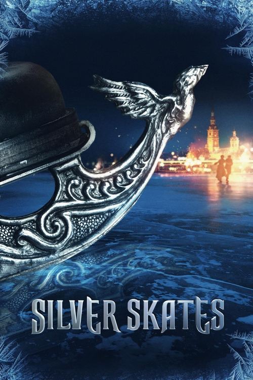 The poster features a mysterious figure in a top hat and wings, standing on a snowy ice rink. The background shows a city skyline at night, with warm lights reflecting on the water. The title "Silver Skates" is prominently displayed at the bottom. The overall mood is mysterious and adventurous.