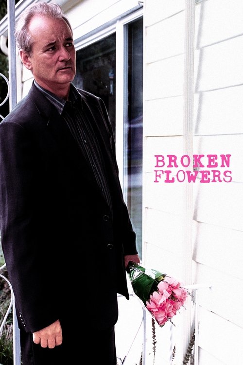 The poster features a somber man in a dark coat holding a bouquet of pink flowers against a white building. The mood is melancholic, with the title "Broken Flowers" in bold pink letters.