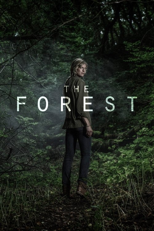 The poster features a lone woman standing in a misty, dark forest, surrounded by lush greenery. The muted greens and browns evoke a mysterious, eerie atmosphere, while the title "The Forest" in stark white letters adds a sense of isolation and suspense.