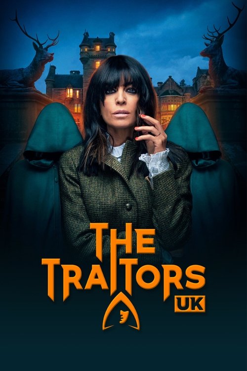 The poster features a woman with dark hair and a serious expression, surrounded by eerie, shadowy figures. The background showcases a spooky haunted house at night, illuminated by warm lights against a dark blue sky. The title "The Traitors" is prominently displayed in bold orange letters, with t...