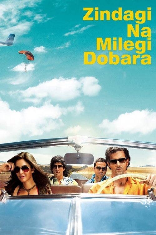 The poster features a vibrant blue sky with fluffy white clouds and a colorful kite soaring overhead. Four people are seated in a classic car, dressed in summer attire, exuding a carefree, sunny mood. The bright yellow text at the top reads "Zindagi Na Milegi Dobara" in bold, eye-catching font.