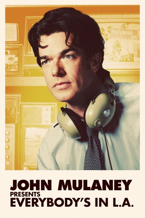 The poster features a close-up of John Mulaney, wearing headphones against a warm, yellow-toned background. His expression is serious, and the overall mood is contemplative. The bold text at the bottom introduces the show, emphasizing its focus on everyday life in Los Angeles.