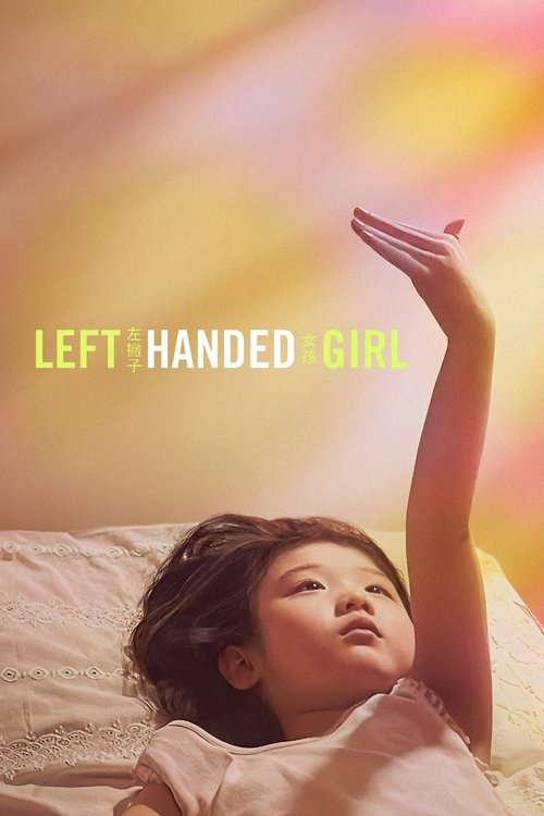 A young girl lies in bed, her left arm raised as if reaching for something above. Warm, golden hues fill the background, creating a dreamy, hopeful atmosphere. The title "Left-Handed Girl" is elegantly placed in the center.