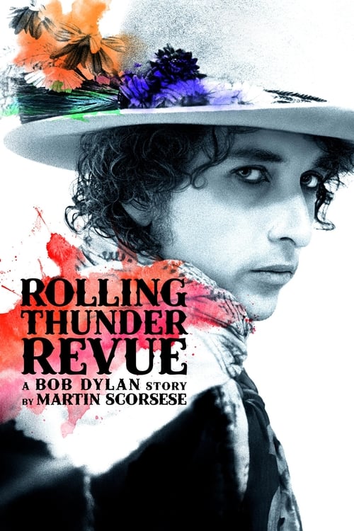 The poster features a striking portrait of Bob Dylan in a dramatic pose, adorned with vibrant floral and feather decorations on his hat. The bold red and black typography emphasizes the film's title, while the dark, moody background enhances the mysterious and intense atmosphere.