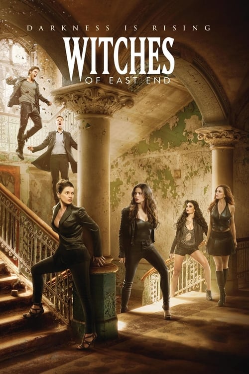 The poster features four women in dark, mysterious outfits standing in a grand, dimly lit room with classical architecture. The warm, golden lighting casts dramatic shadows, creating an eerie atmosphere. The title "Witches of East End" is prominently displayed in bold, gothic-style lettering, wit...