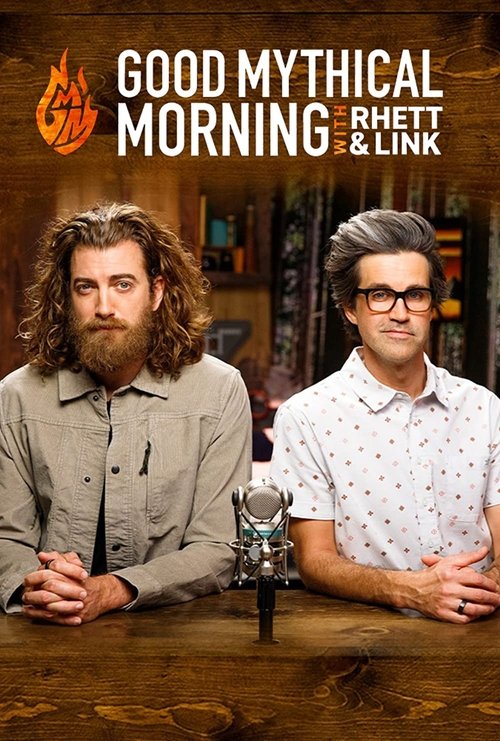 The poster features two men with distinct styles—curly hair and beard on the left, glasses and styled hair on the right—seated at a wooden desk with a microphone. Warm lighting and earthy tones create a cozy, inviting atmosphere that suggests a friendly and approachable talk show.
