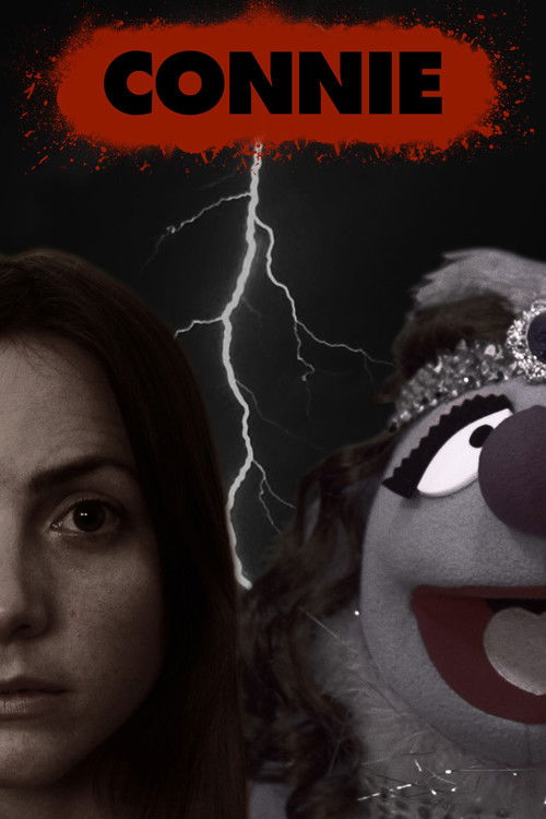 The poster features a woman with a serious expression and a puppet with a wide grin against a dark background. A bright lightning bolt adds a dramatic effect, suggesting a supernatural or horror theme. The red and black color scheme creates a mysterious and intense atmosphere.