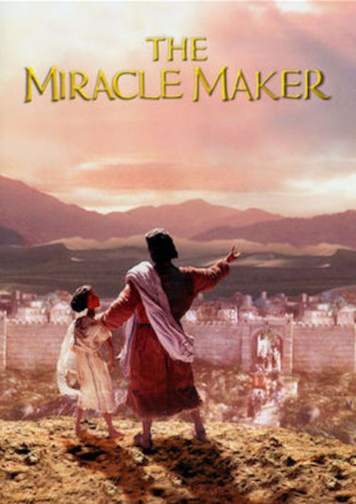The poster features a woman in a flowing red robe and child in white standing against a warm sunset backdrop. The title "The Miracle Maker" is elegantly displayed at the top. The scene evokes a sense of wonder and spiritual significance, with the warm tones of the sky and earth suggesting a divin...