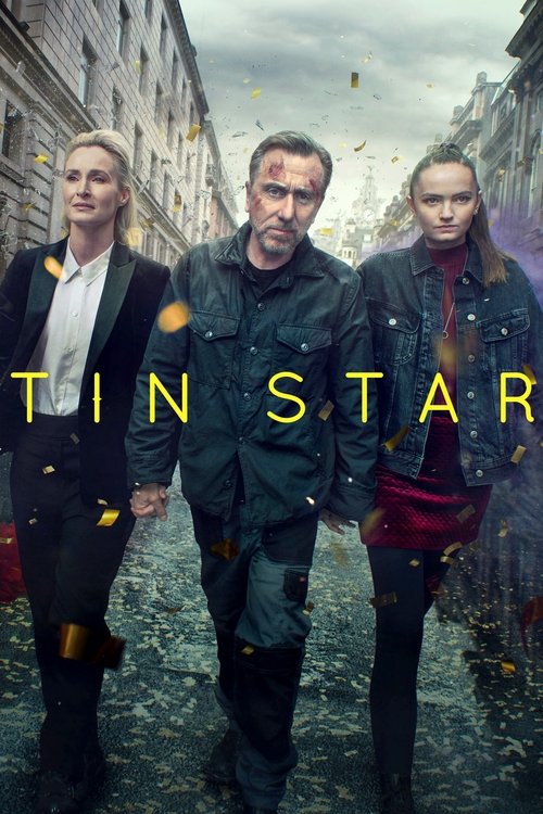 The poster features three men walking down a cobblestone street, with a dramatic, moody atmosphere. The warm golden text "TIN STAR" stands out against the cool, muted tones of the scene.