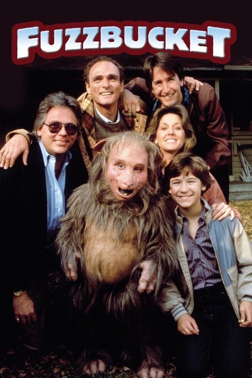 The poster features a group of six people posing with a large, furry creature in the center, creating a humorous and whimsical atmosphere. The bold red and white "FUZZBUCKET" title stands out against the dark background, emphasizing the comedic tone of the movie.
