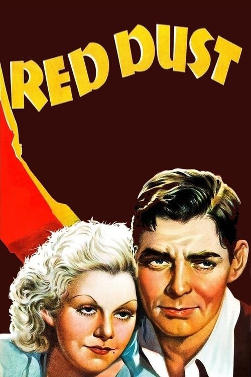 This vintage movie poster features a dramatic portrait of a man and woman against a deep red background. The bold yellow title "RED DUST" dominates the top, evoking a sense of urgency and danger. The woman's contemplative expression and the man's stoic gaze suggest a story of intrigue and suspense.