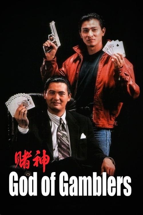The poster features two men against a stark black background, one in a red jacket holding playing cards and the other in a suit with a tie. The red jacket and playing cards create a vibrant contrast against the dark backdrop, while the serious expressions and confident poses convey a sense of int...
