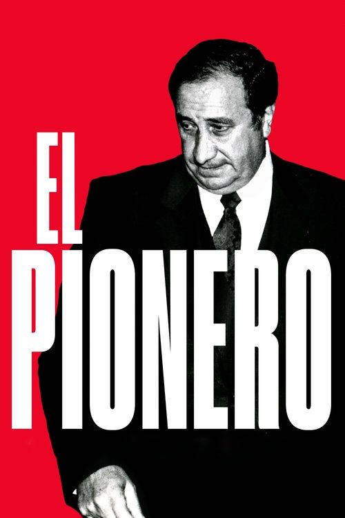 The poster features a man in a dark suit against a bold red background, exuding an air of authority and mystery. The title "EL PIONERO" is prominently displayed in large white letters, suggesting a narrative of exploration and discovery. The overall composition conveys a sense of adventure and in...