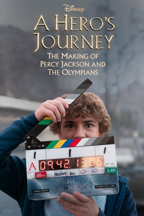 The poster features a young boy with curly brown hair holding a movie clapperboard, symbolizing the behind-the-scenes nature of the film. The background shows a misty, mountainous landscape, evoking the mythical Greek setting. The title and subtitle are elegantly written in gold, with Disney bran...
