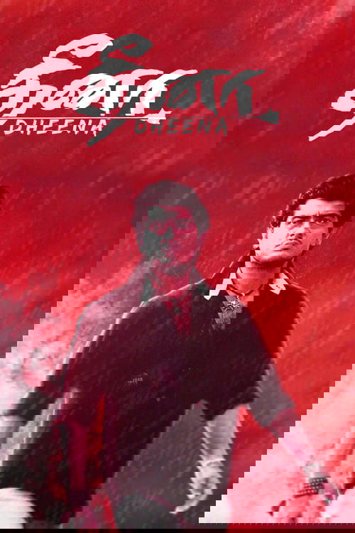 The poster features a man in a dark shirt against a vibrant red background, evoking a dramatic and intense mood. The title "Dheena" is prominently displayed in stylized white text, suggesting a powerful narrative. The overall composition conveys a sense of action and emotional depth, appealing to...