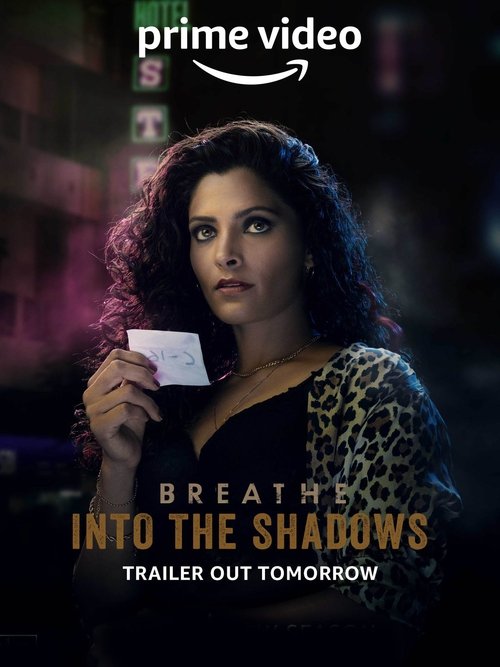 The poster features a woman with dark curly hair holding a small white card against a dark, moody background. The color palette is dominated by deep blacks and purples, creating an eerie atmosphere. The text "Breathe: Into the Shadows" is prominently displayed in bold, golden letters, while the A...