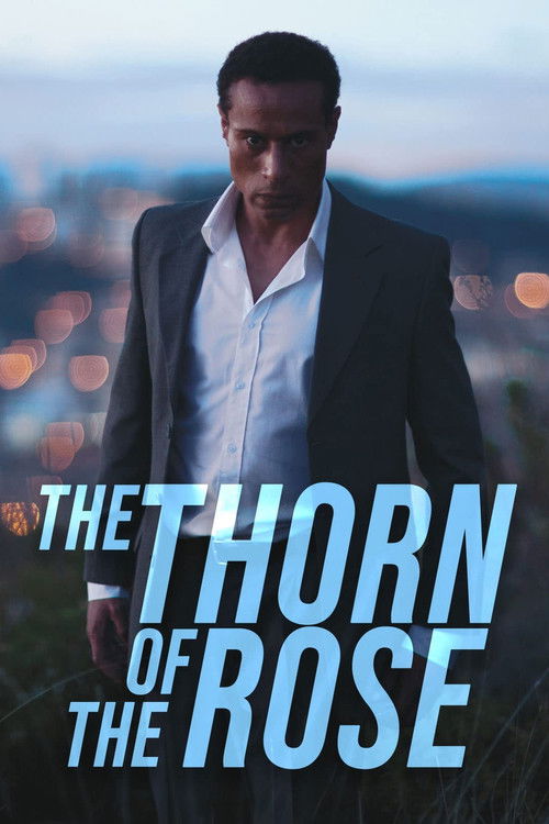 The poster features a man in a sharp suit against a twilight cityscape, evoking mystery and drama. The bold, glowing title "The Thorn of the Rose" dominates the foreground, suggesting intrigue and emotional depth. The overall mood is moody and cinematic, hinting at a complex narrative.