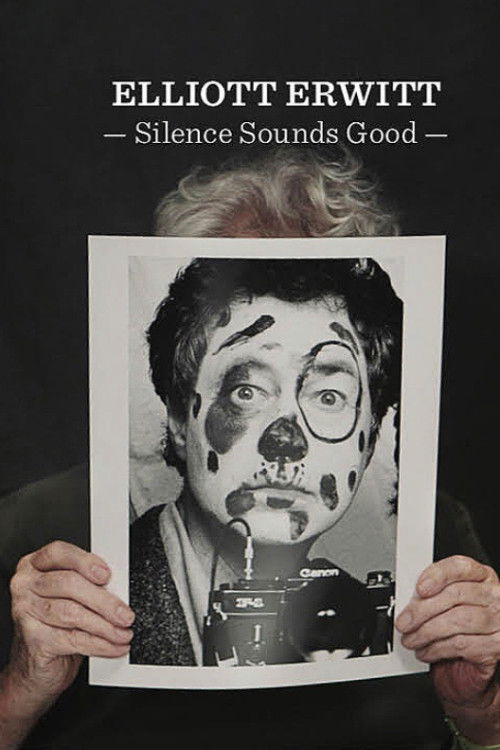 The poster features a man with a clown mask and black-and-white photo of a camera, set against a dark background. The title "Elliott Erwitt - Silence Sounds Good" is prominently displayed at the top.