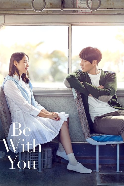 The movie poster features a couple sitting on a train, bathed in soft, warm sunlight. The woman wears a white dress, while the man sports a green jacket and white shirt. The mood is romantic and nostalgic, capturing a moment of connection between two people in a serene, scenic setting.