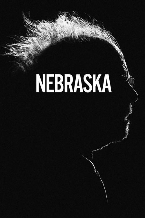 The poster features a stark black silhouette of a person's profile against a dark background, with the word "NEBRASKA" prominently displayed in white. The mood is mysterious and evocative, suggesting a blend of nostalgia and intrigue.