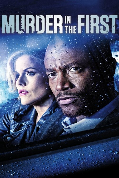 The poster features two characters in a car, with raindrops on the windshield and a dark blue background. The mood is suspenseful, with the characters' serious expressions conveying tension. The title "Murder in the First" is prominently displayed at the top in bold white letters.