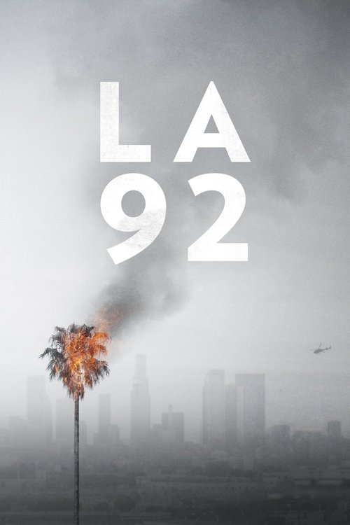 The poster features a dramatic, smoky cityscape with a burning palm tree in the foreground, evoking a sense of urban decay and impending destruction. The muted gray and brown tones, combined with the stark white text, create a somber and mysterious atmosphere.