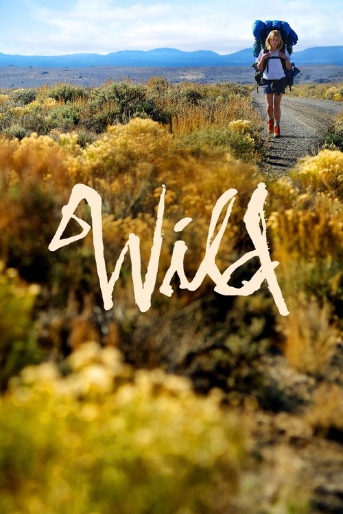 A lone hiker stands on a dirt path in a golden desert landscape, carrying a backpack, with the word "Wild" written in white script across the foreground. The scene captures a sense of adventure and freedom, evoking a warm, inviting mood.