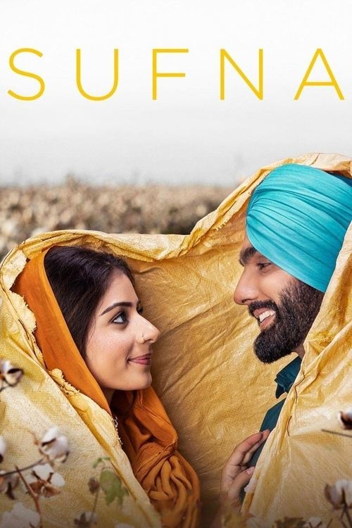 The poster features a couple nestled inside a cozy, yellow tent, sharing a warm, intimate moment. The man wears a vibrant turquoise turban, while the woman dons an orange scarf. Their expressions convey affection and connection, set against a soft, dreamy background that enhances the serene and r...
