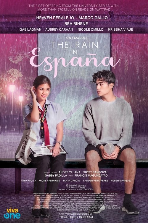 The poster features two young men sitting on a bench against a vibrant purple background. The mood is melancholic yet hopeful, with soft lighting and rain motifs enhancing the emotional tone. The title "The Rain in España" is prominently displayed in elegant script, suggesting a story set in Spain.