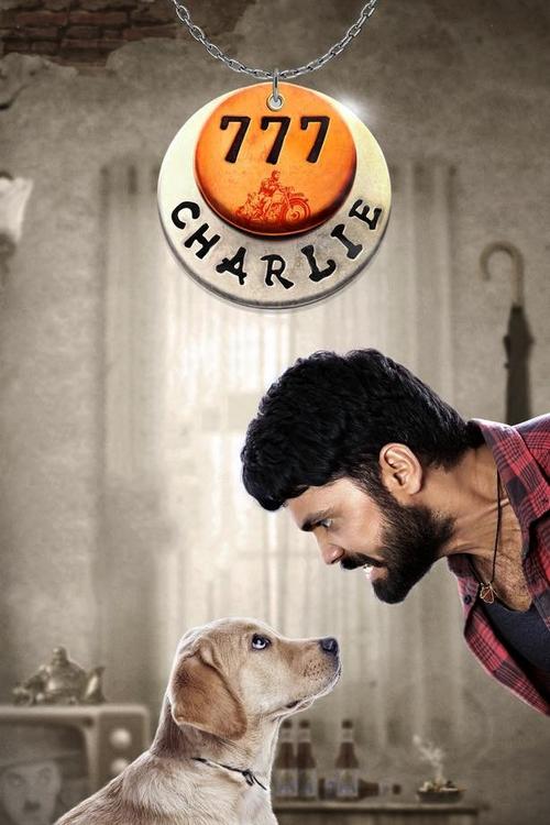 The poster features a man with a beard and a dog looking up at each other against a muted, sepia-toned background. A circular sign reading "777 CHARLIE" hangs from the top, adding a whimsical touch. The mood is warm and nostalgic, evoking a sense of friendship and humor.