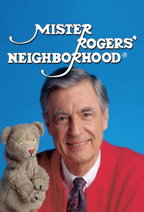 The poster features a warm, inviting scene with a smiling man in a red sweater and tie, exuding a friendly and approachable demeanor. A soft gray teddy bear rests gently on his shoulder, adding a touch of nostalgia and charm. The bright blue background enhances the cheerful and nostalgic mood, ca...
