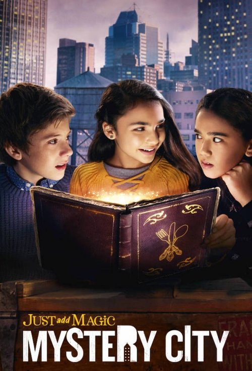The poster features three children in a cityscape at dusk, illuminated by a warm glow from a book they're reading. The mood is magical and curious, with rich colors like deep purples and oranges contrasting against the dark city skyline.