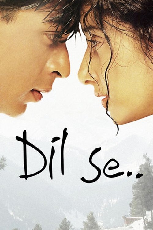 The poster features a tender, intimate close-up of two characters leaning in toward each other, their faces nearly touching. The soft, warm tones of their skin contrast with the muted, snowy background, evoking a sense of longing and emotional connection. The title "Dil Se.." is elegantly written...
