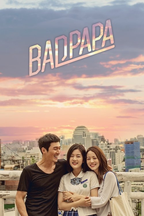 A family of three stands joyfully against a vibrant sunset backdrop, with the title "BADPAPA" prominently displayed in bold, pink letters. The warm hues of the sky evoke a nostalgic, heartwarming mood, suggesting a blend of humor and familial love.